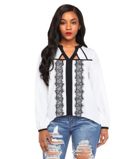 White and black lace-orned blouse