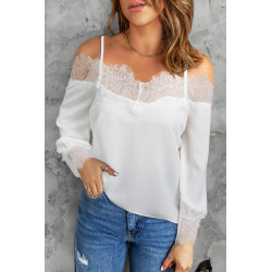 White lace-trimmed blouse with shoulder slits