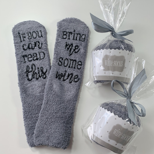 Grey fluffy socks with wine...