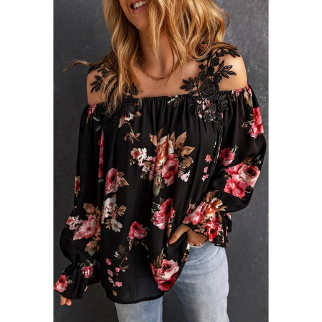 Svart blus med blommönster med dekorativa broderade hängslen